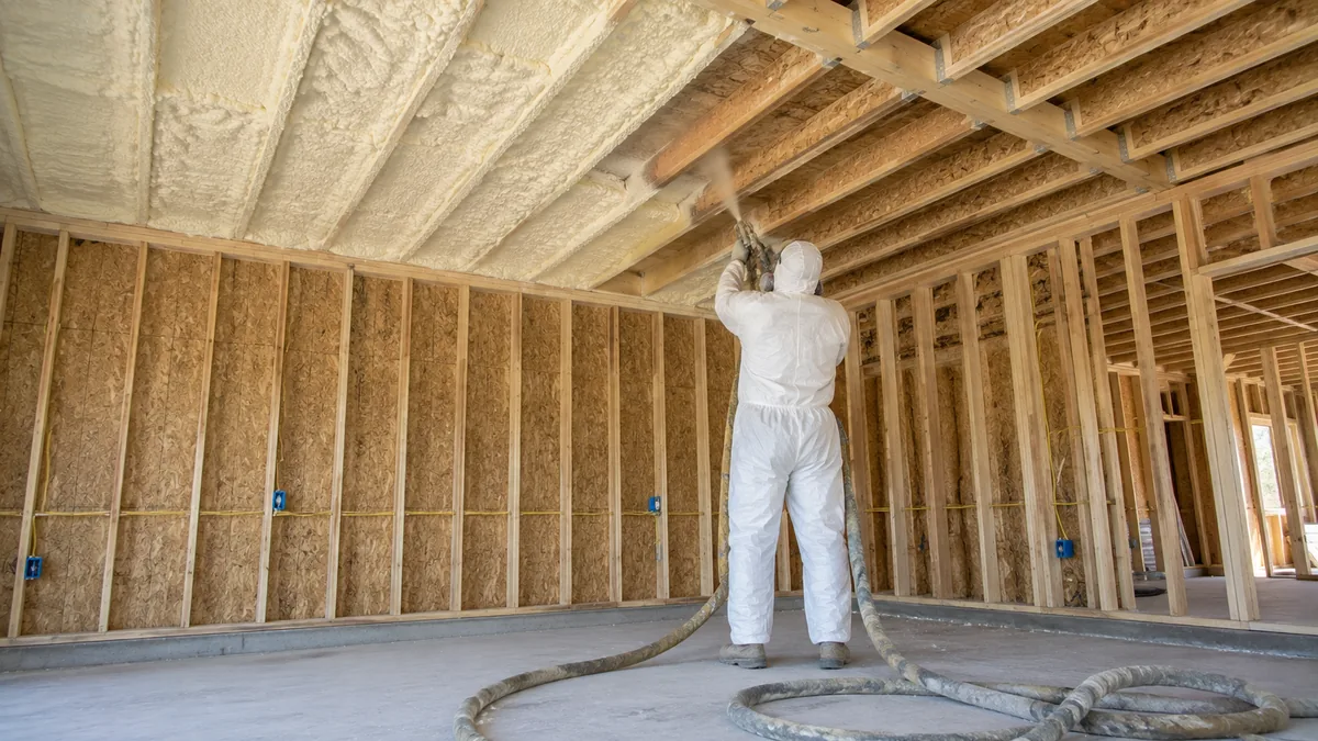 A garage ceiling in a new Severance CO build getting foamed before drywall by local insulation contractors